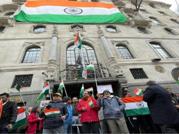 Britain: People gathered with the tri-colour in front of the Indian High Commission